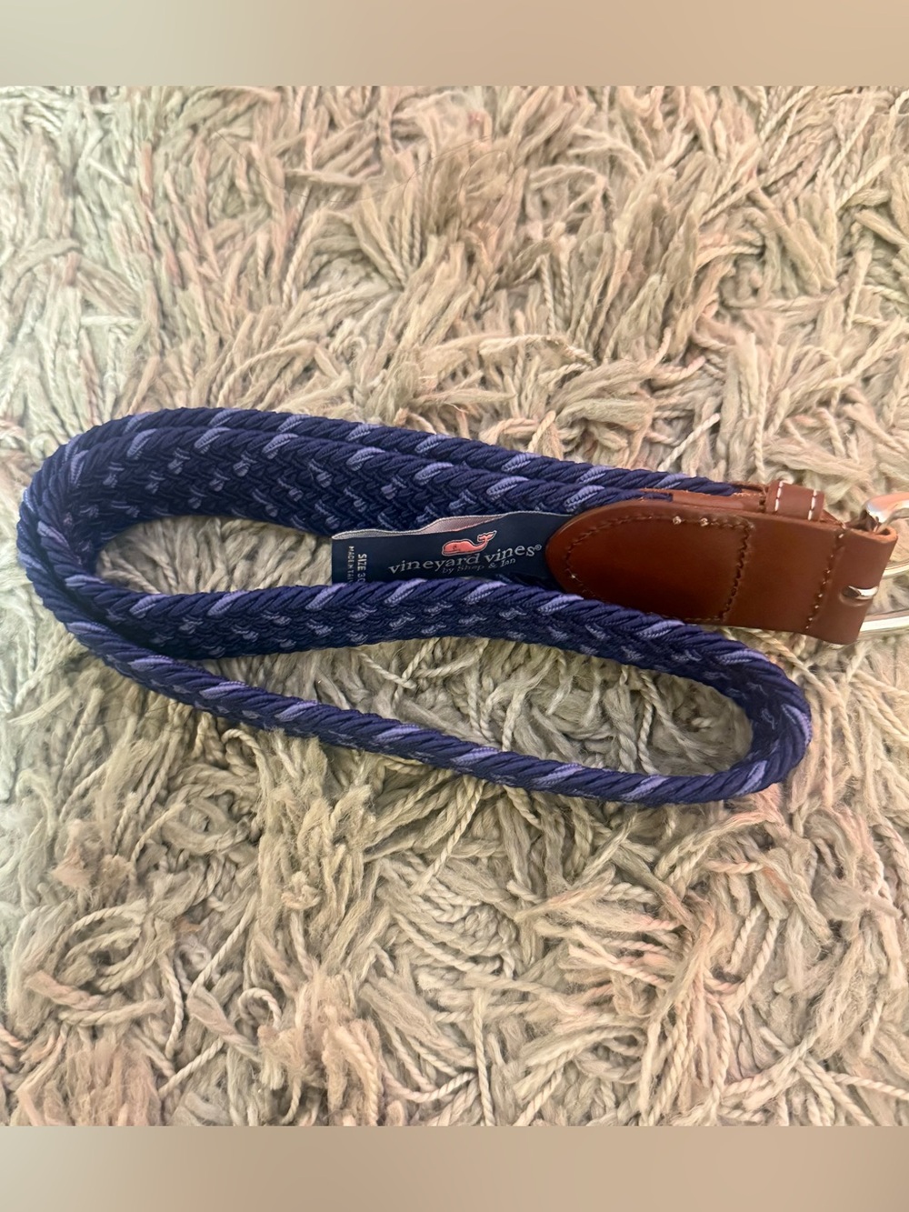 Vineyard Vines braided stretch belt in a blue woven pattern with a brown leather